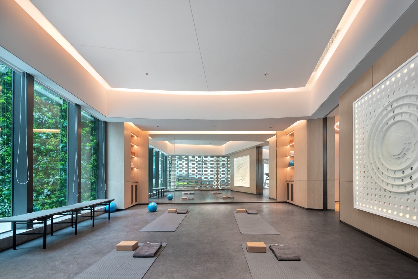 Spacious yoga studio with modern design and abundant natural light.